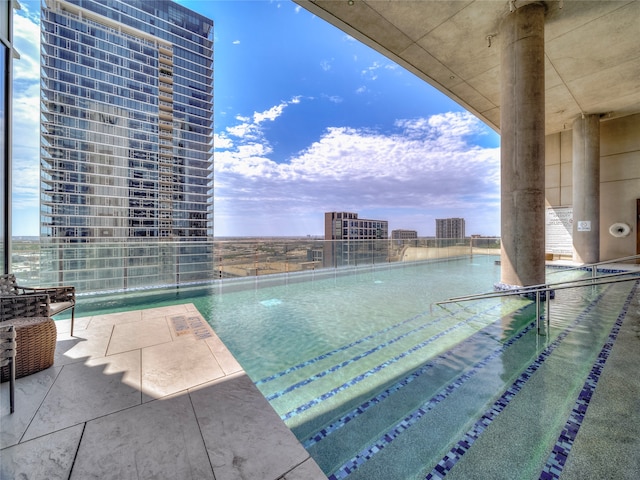 view of swimming pool featuring pool water feature