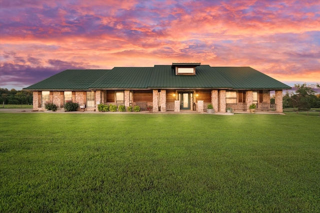 view of front of house with a lawn