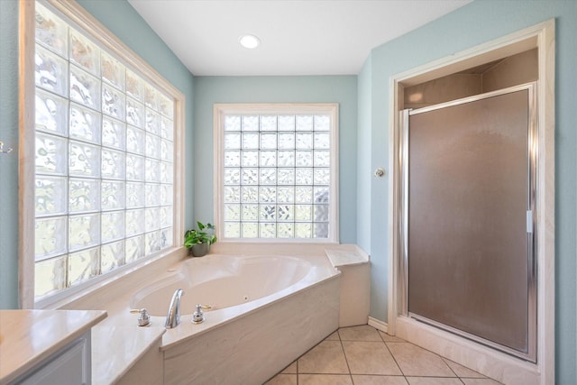 bathroom with tile patterned flooring, vanity, and independent shower and bath