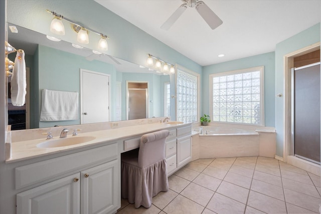 bathroom featuring tile patterned flooring, shower with separate bathtub, vanity, and ceiling fan