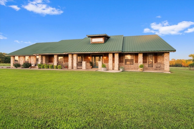 back of house featuring a yard