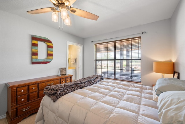 bedroom with ensuite bathroom and ceiling fan