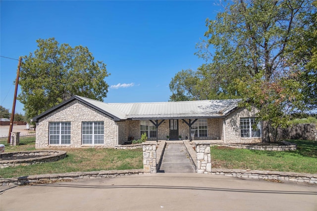 ranch-style home with a front yard