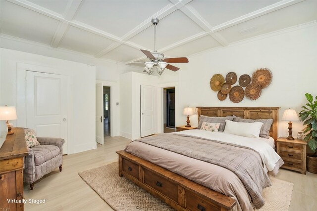 bedroom featuring ceiling fan, light hardwood / wood-style flooring, beamed ceiling, and coffered ceiling