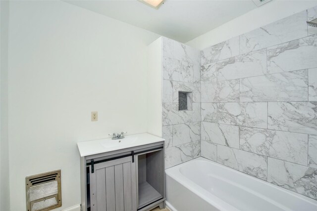 bathroom with heating unit and vanity