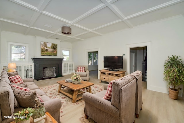 living room featuring light hardwood / wood-style flooring, beamed ceiling, and coffered ceiling