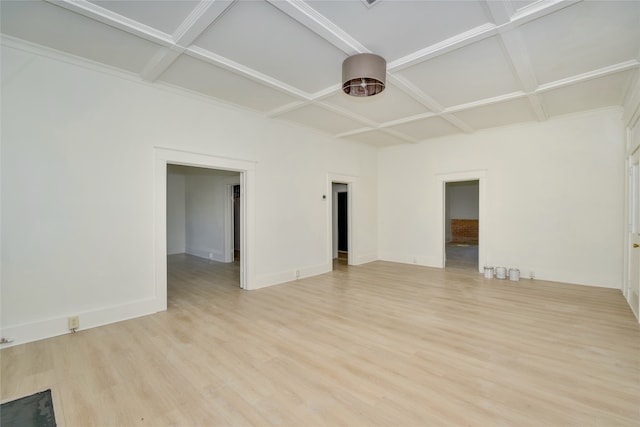 empty room with light wood-type flooring and coffered ceiling