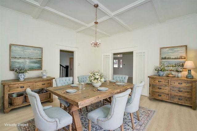 dining room with beamed ceiling, a notable chandelier, light hardwood / wood-style floors, and coffered ceiling