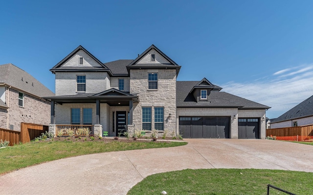 view of front of home with a front lawn and a garage