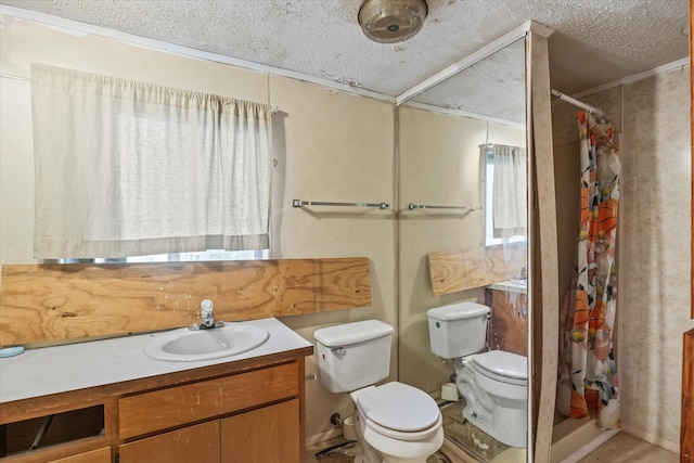 bathroom featuring a textured ceiling, vanity, and toilet