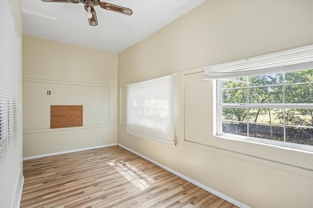 spare room with ceiling fan, light hardwood / wood-style floors, and lofted ceiling