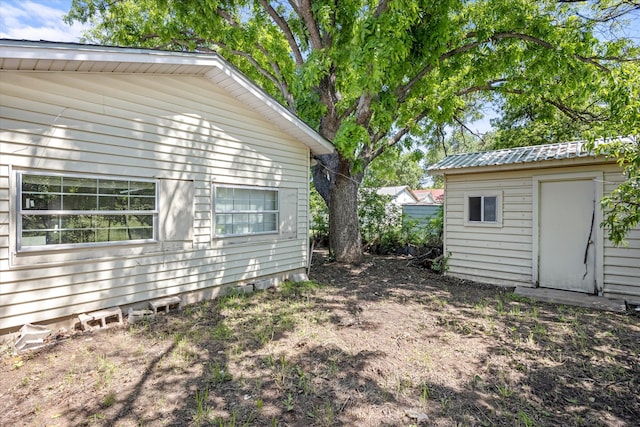 exterior space featuring a shed