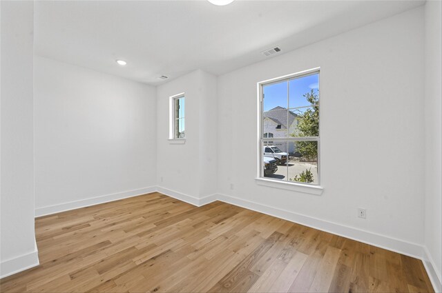 unfurnished room featuring light wood-type flooring