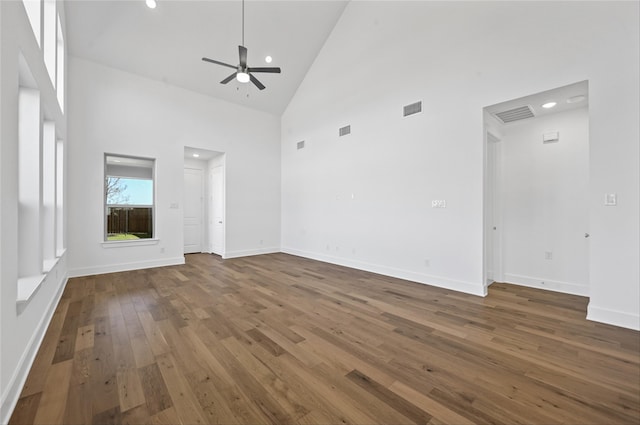 unfurnished living room featuring ceiling fan, hardwood / wood-style floors, and high vaulted ceiling