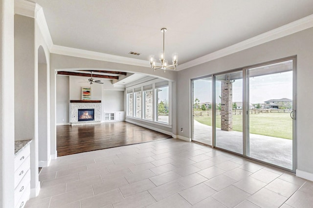 unfurnished living room featuring crown molding, beamed ceiling, light tile patterned flooring, and ceiling fan with notable chandelier