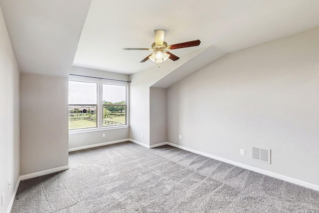 bonus room featuring ceiling fan, light colored carpet, and lofted ceiling