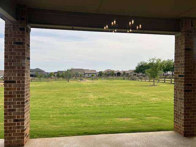 view of home's community featuring a lawn