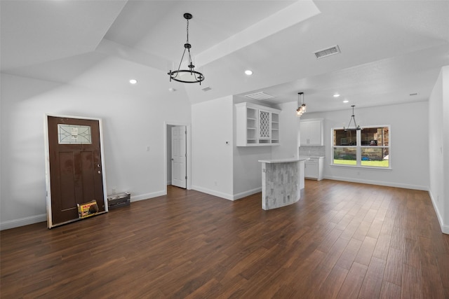 unfurnished living room featuring visible vents, baseboards, a chandelier, recessed lighting, and dark wood-style floors