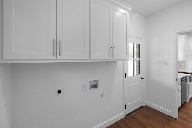 laundry area featuring cabinets, hookup for a washing machine, dark hardwood / wood-style flooring, and electric dryer hookup