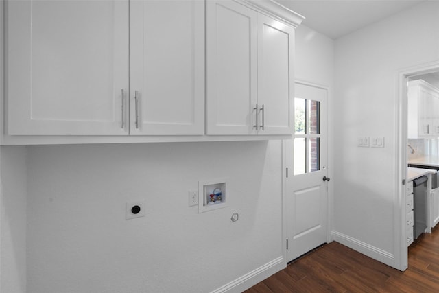 laundry room featuring baseboards, dark wood finished floors, cabinet space, electric dryer hookup, and washer hookup