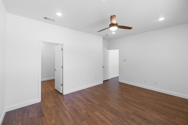 unfurnished room featuring dark hardwood / wood-style flooring and ceiling fan