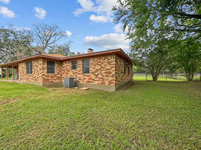 view of home's exterior featuring a lawn and cooling unit