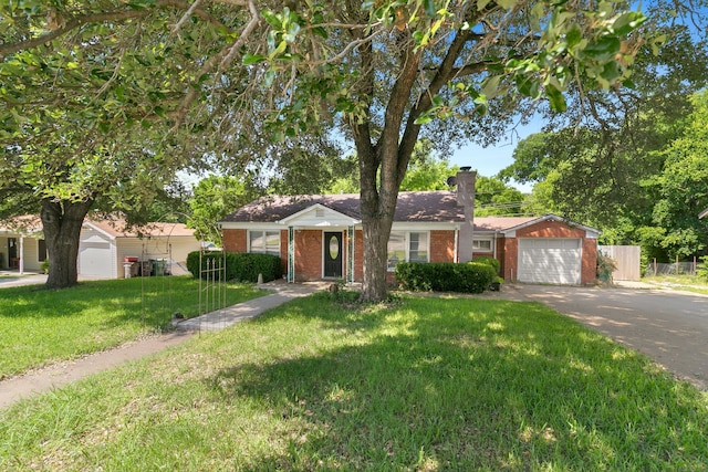 single story home featuring a front lawn and a garage