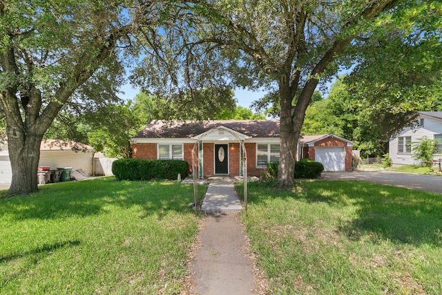 single story home with a garage and a front lawn