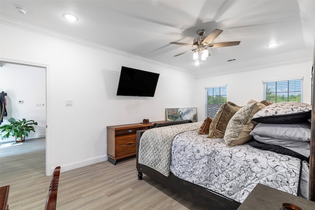 bedroom featuring ornamental molding, ceiling fan, and light hardwood / wood-style flooring