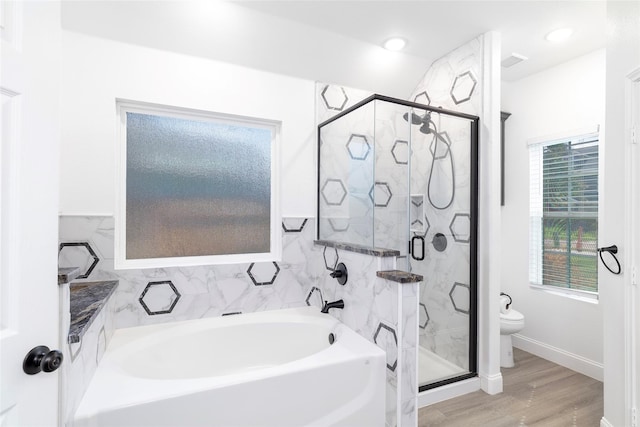 bathroom with independent shower and bath, hardwood / wood-style flooring, toilet, and tile walls