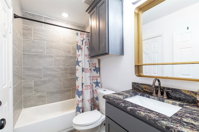 full bathroom with vanity, toilet, and shower / bath combo with shower curtain