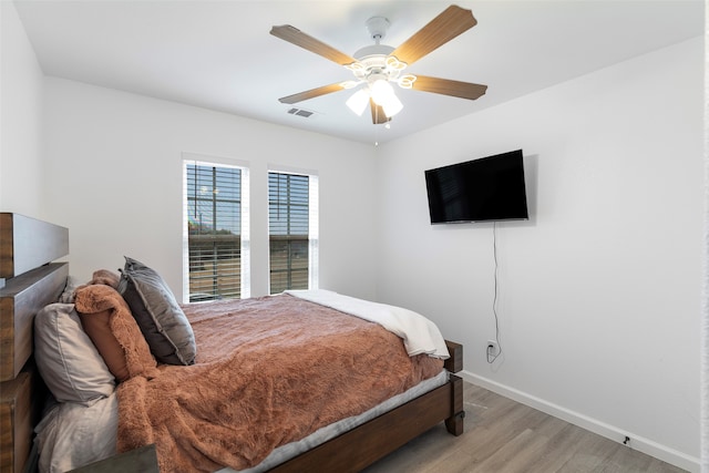 bedroom featuring hardwood / wood-style flooring and ceiling fan