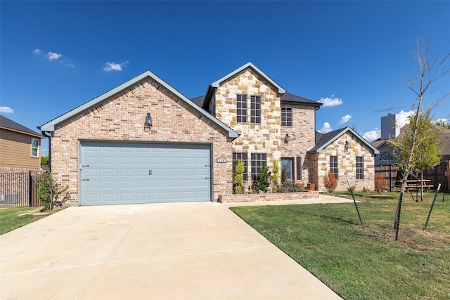 front of property with a garage and a front lawn