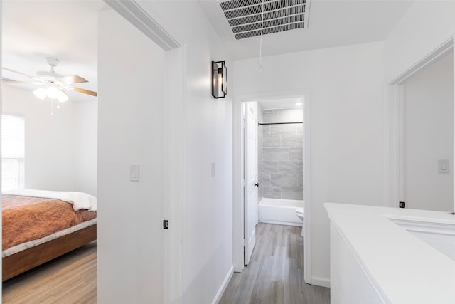 hallway with light wood-type flooring