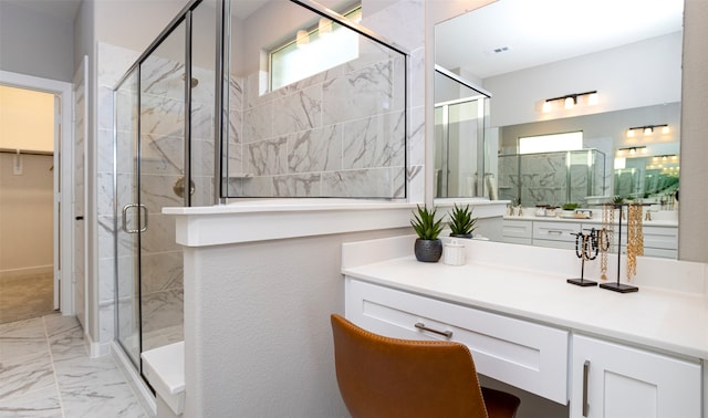 bathroom with tile flooring, an enclosed shower, and vanity