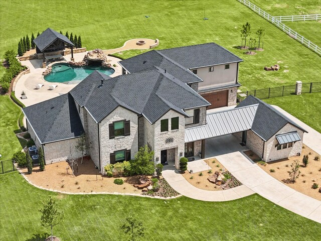 view of front facade with a garage and a front lawn