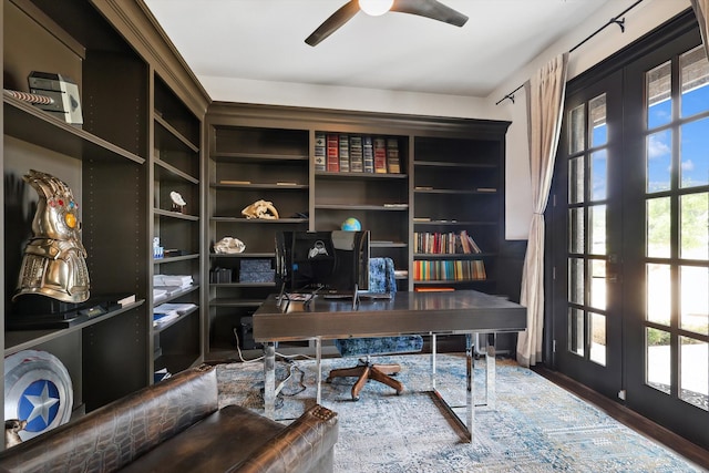 home office with hardwood / wood-style flooring, ceiling fan, and french doors