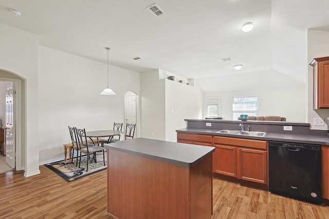 kitchen with light wood-type flooring, sink, pendant lighting, dishwasher, and lofted ceiling