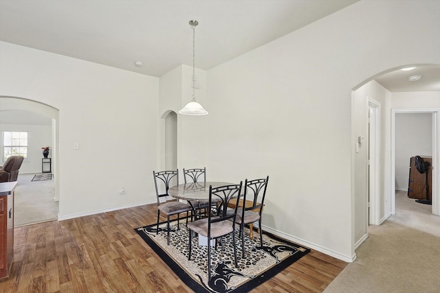 dining room with hardwood / wood-style flooring