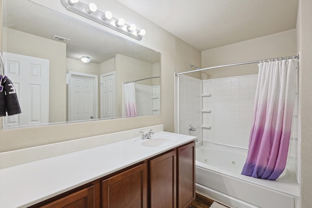 bathroom featuring vanity and shower / bath combo with shower curtain