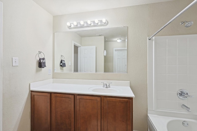 bathroom with vanity and  shower combination