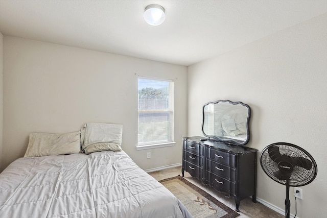 bedroom featuring light carpet