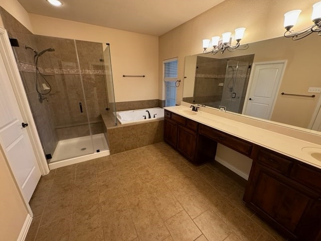 bathroom featuring a chandelier, tile patterned flooring, and separate shower and tub