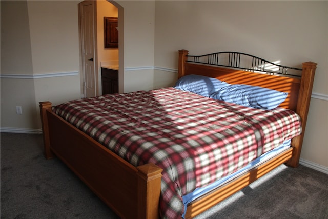 carpeted bedroom with ensuite bathroom