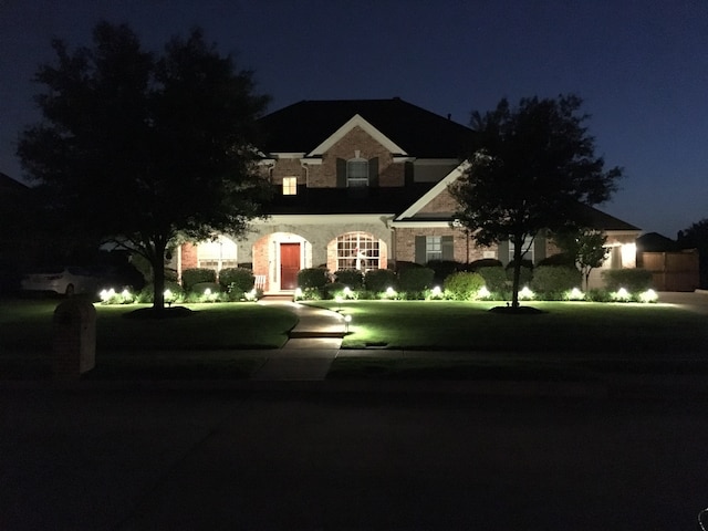 view of front of house with a lawn