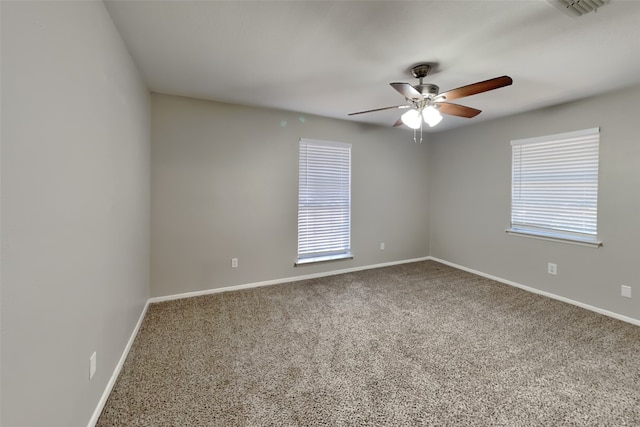 spare room featuring carpet floors and ceiling fan