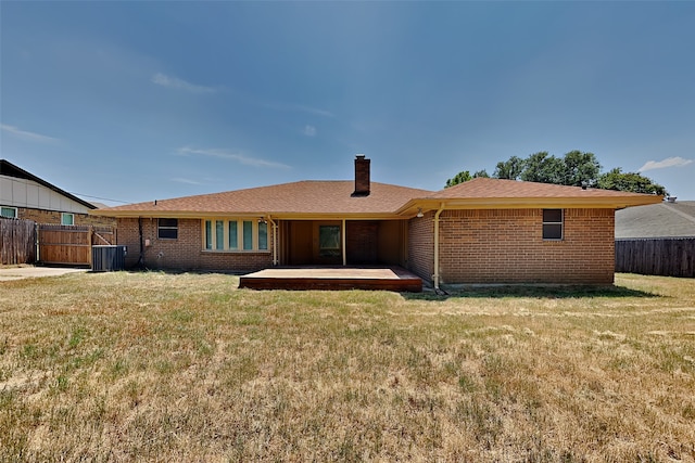 back of property featuring a patio area and a lawn