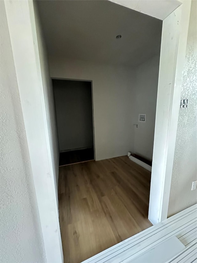 laundry room with hardwood / wood-style floors