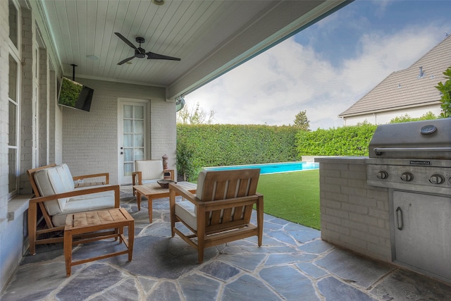 view of terrace with outdoor lounge area, ceiling fan, and grilling area