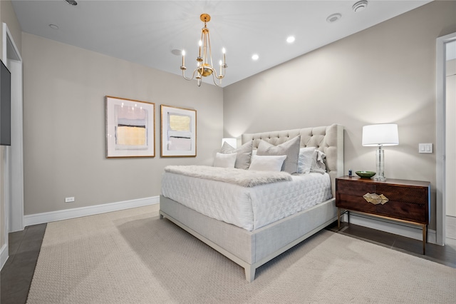 bedroom featuring a notable chandelier